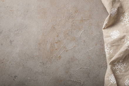 Kitchen stone table with towel top view with copy space concrete beige, an Abstract Photo by Budarinphoto