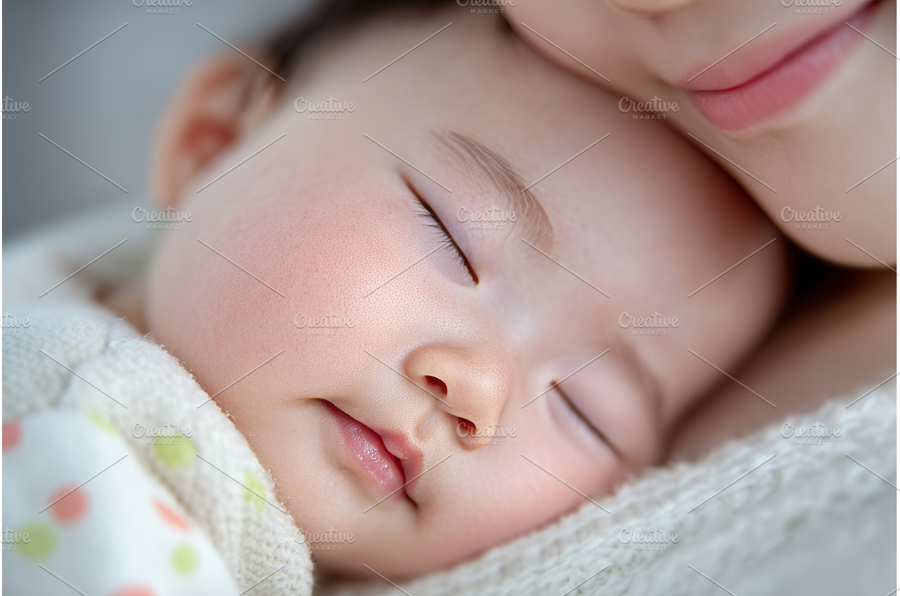 A young mother cradles her newborn, a Food & Drink Photo by ZinetroN