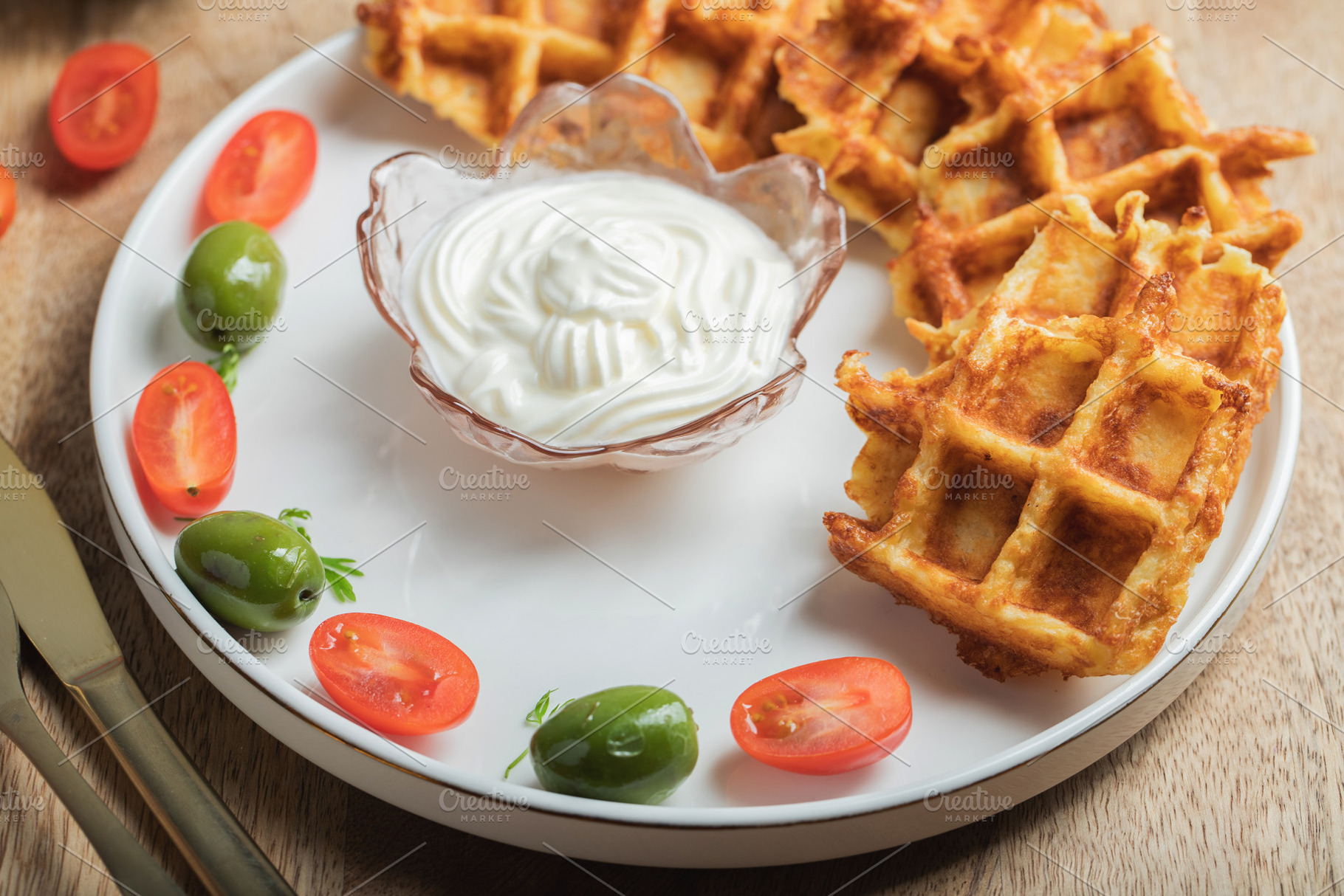 Top view of Homemade Potato Waffles, ricotta cheese and mayonese sauce. Served, a Food & Drink Photo by Budarinphoto
