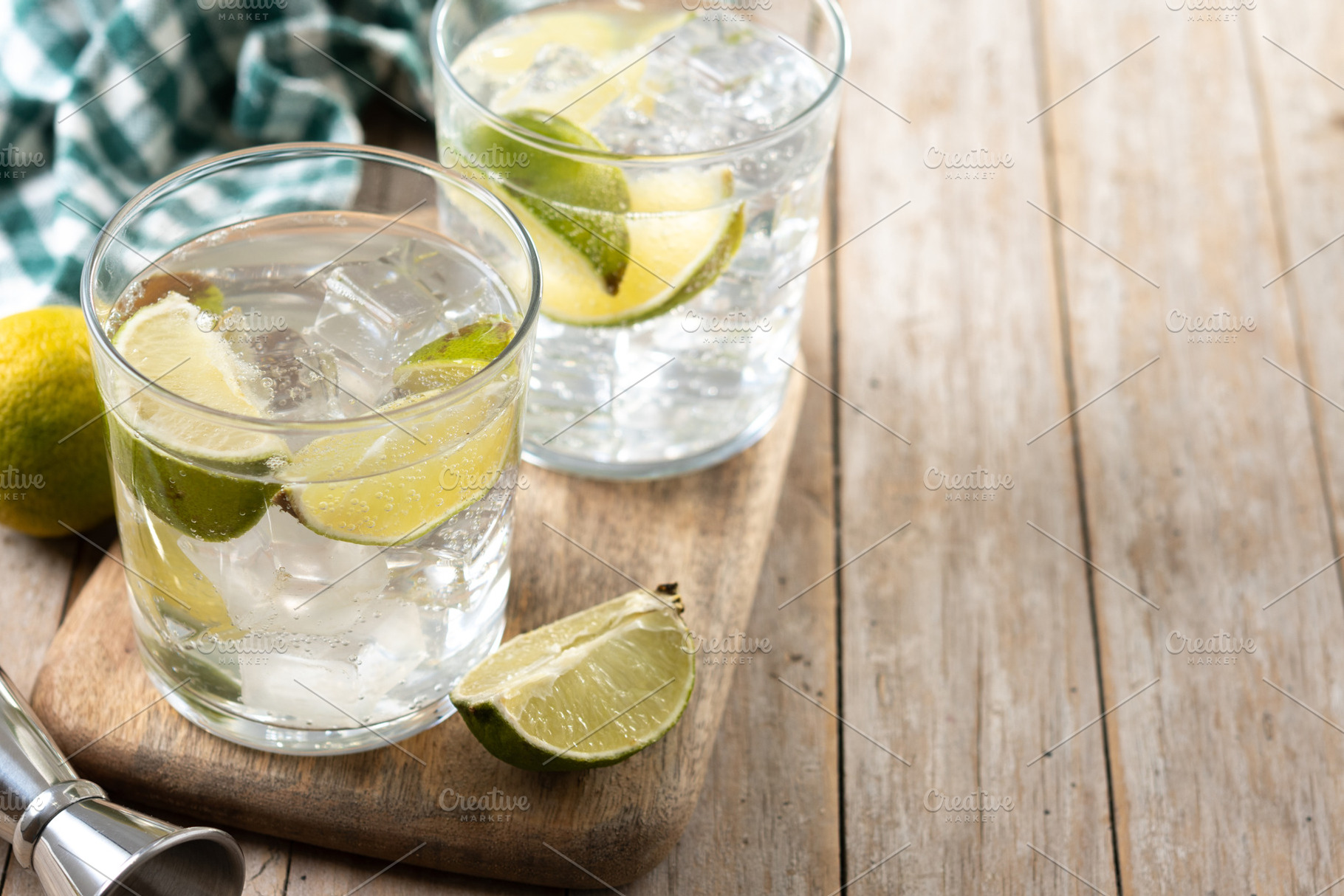 Glass of vodka tonic cocktail on wooden table, a Food & Drink Photo by etorres69