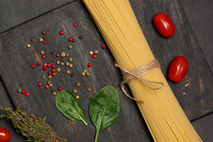 Flat lay of fresh spinach, cherry tomatoes, spaghetti, and spice, a Food & Drink Photo by ndanko