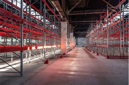 Warehouse with empty high pallet, an Industrial Photo by Jan Jack Russo Media