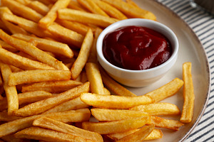 Homemade Golden French Fries with Ketchup, side view., a Food & Drink Photo by LiudmylaChuhunova