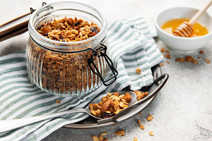 Homemade granola cereal with oats nuts and dried fruits, a Food & Drink Photo by Olena Rudo