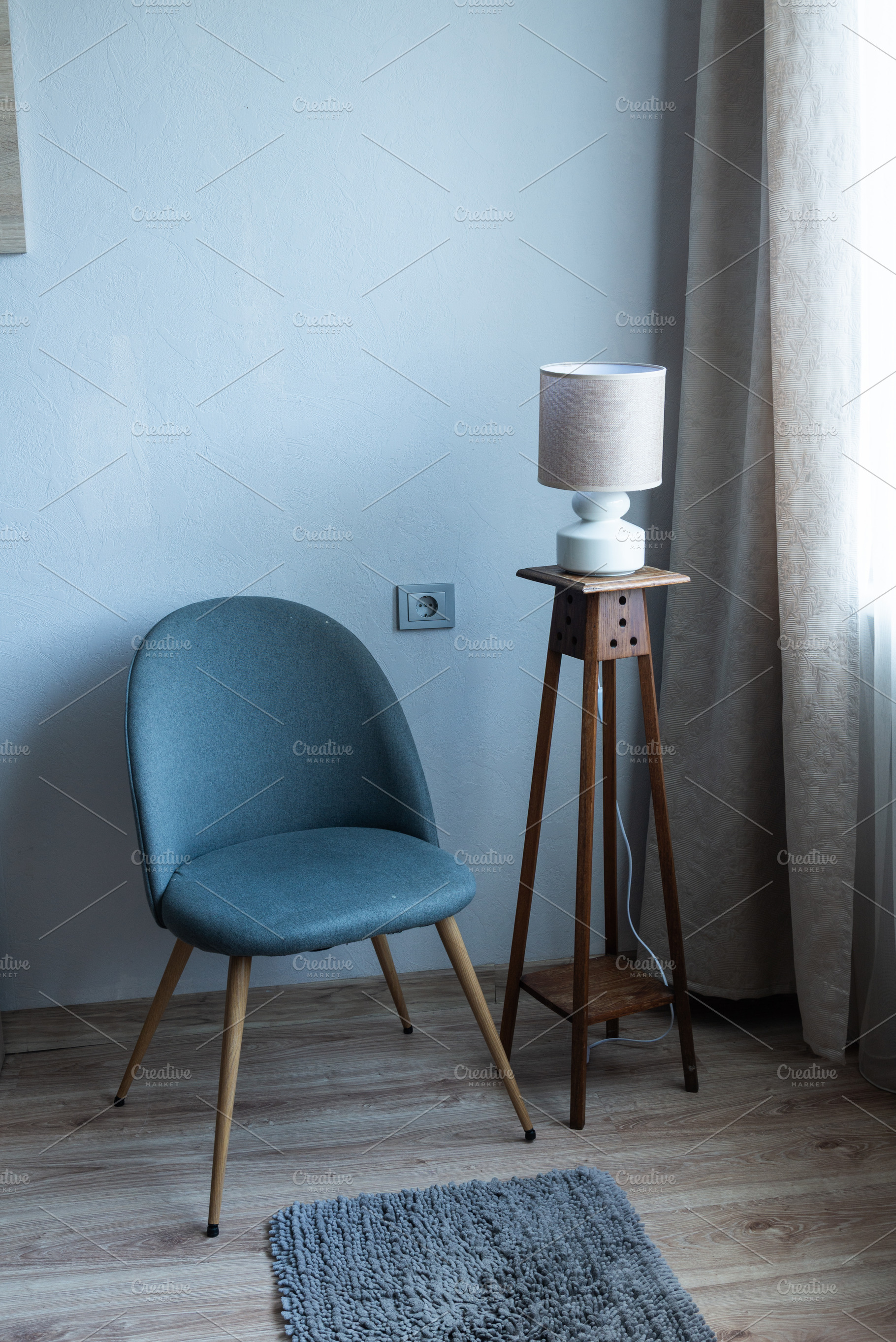 Minimalist armchair in modern living room interior with floor la, an Industrial Photo by MDBildes