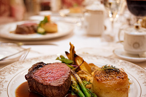 Gourmet steak dinner plated with asparagus and potato gratin in, a Food & Drink Photo by Studio ANNA