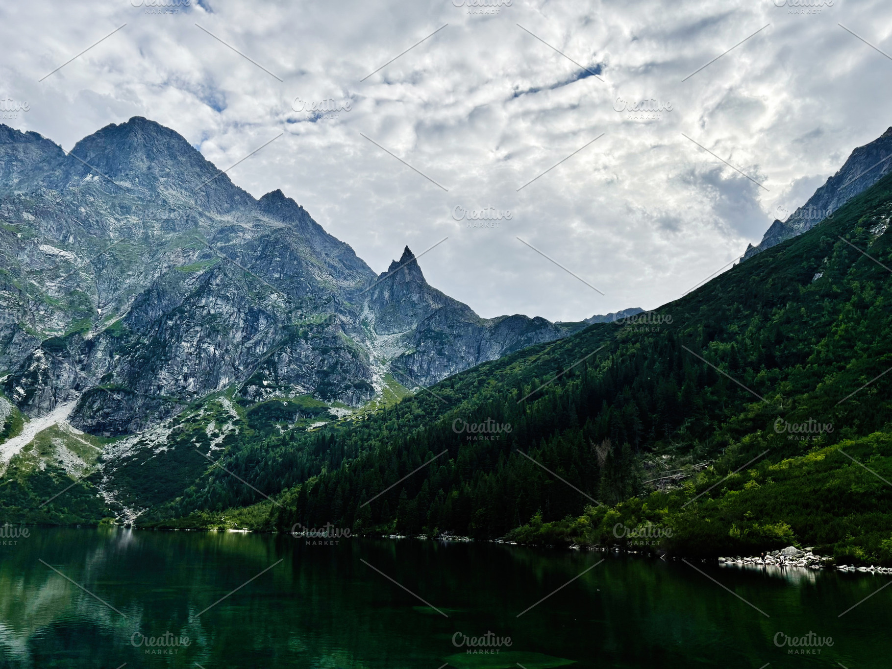 Tranquil mountain lake surrounded by rugged peaks near Zakopane Poland landscap, a Nature Photo by AS photostudio