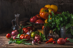 Assorted tomatoes on dark rustic