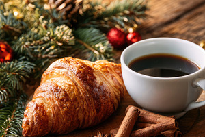 Christmas breakfast with croissant coffee and festive decoration