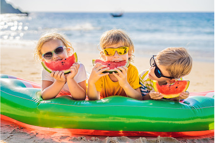 Children eat watermelon on the beach, a Sports & Recreation Photo by Elizaveta Galitskaya
