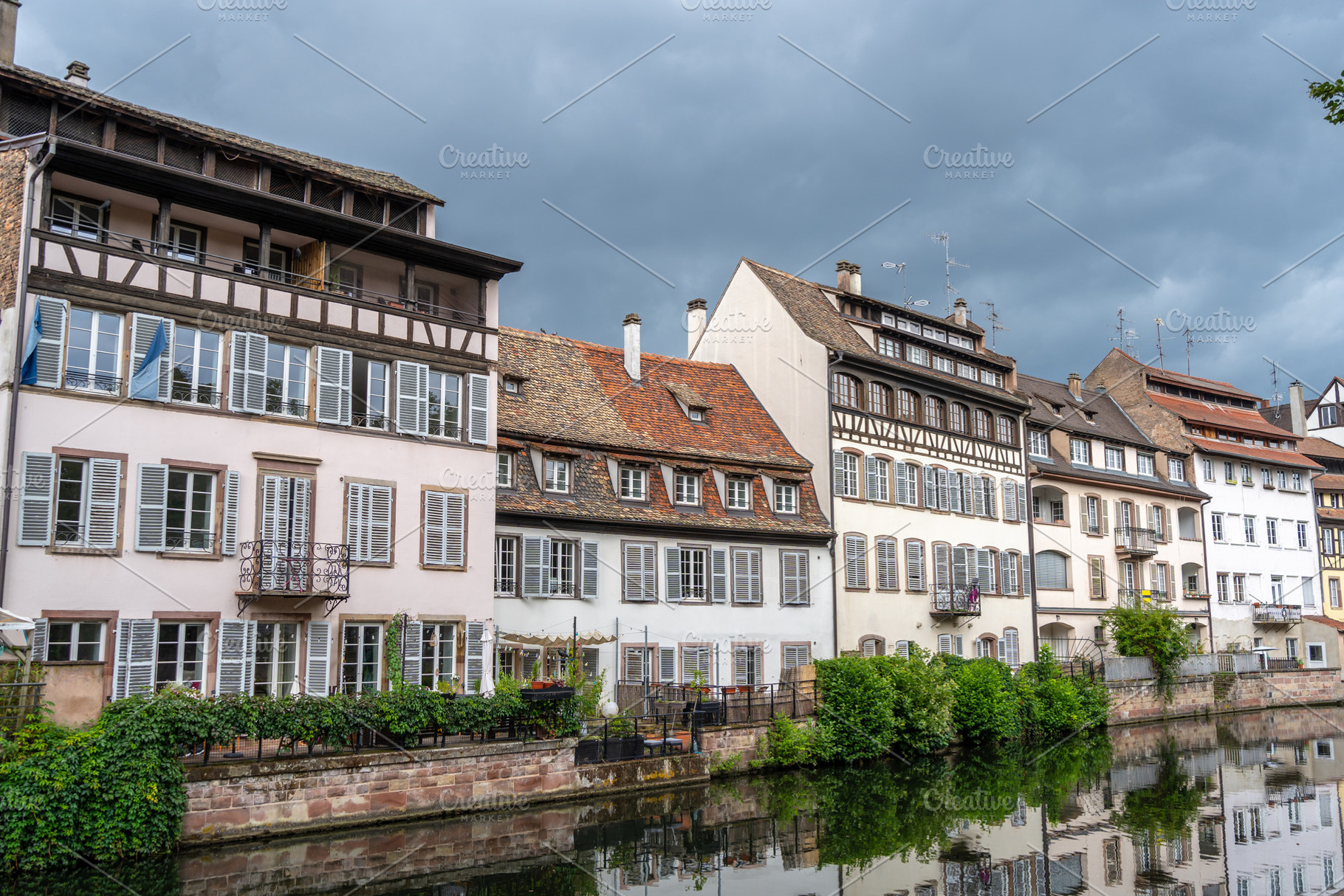 Half timbered houses by the river in Strasbourg, France, an Architecture Photo by GoodGoods
