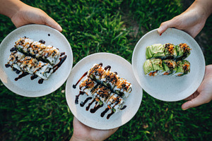 Sushi rolls outdoors with friends, a Photo by Beautiful things