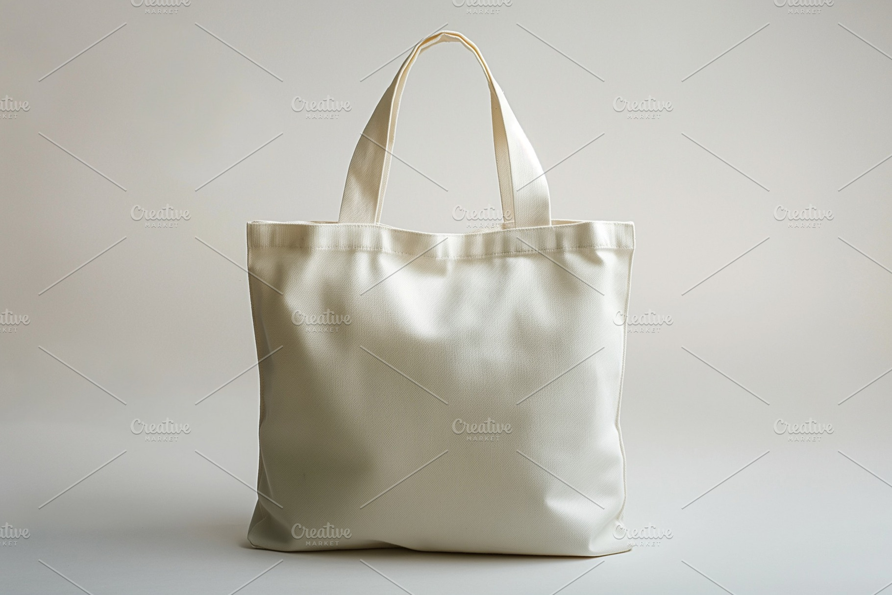 A stylish, empty beige tote bag with two sturdy handles, perfect for everyday u, a Business Photo by ImageMir