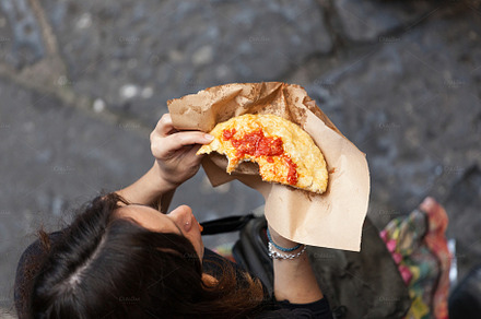 Woman photographed from above eating