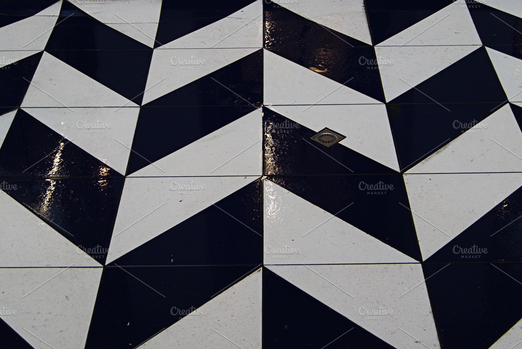 Geometric wet tile pattern featuring black and white designs captured in Denmar, a Photo by AS photostudio