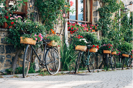 Bicycles in the street with flowers