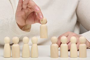 Conceptual photo of a recruitment process, a person's hand picki, a Business Photo by ndanko