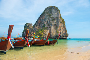 Row of boats at tropical beach, a Nature Photo by Vapi