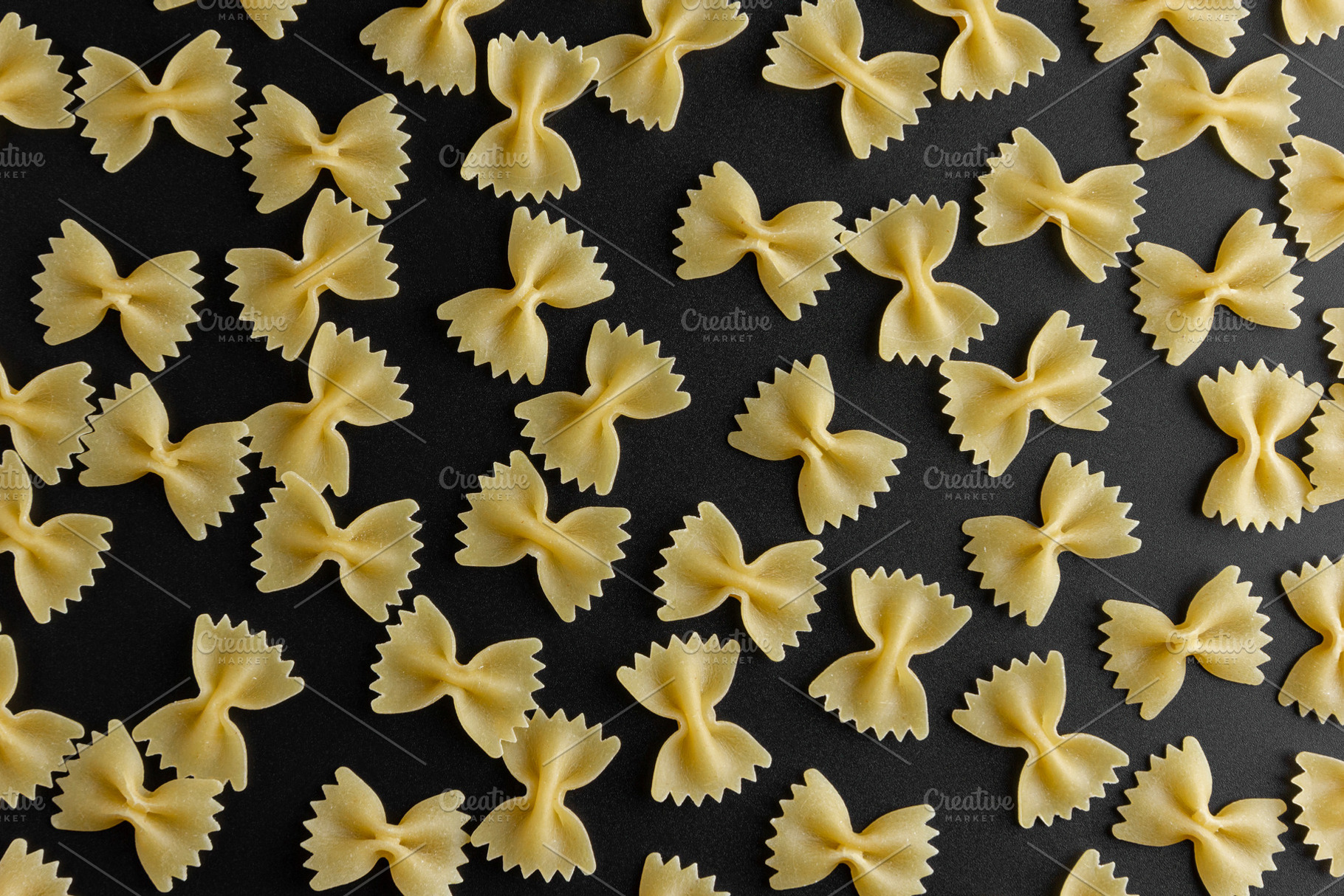 Raw pasta farfalle pattern, a Food & Drink Photo by Dina Belashova