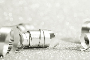 Silver curling ribbons creating, a Holiday Photo by Anna Efetova