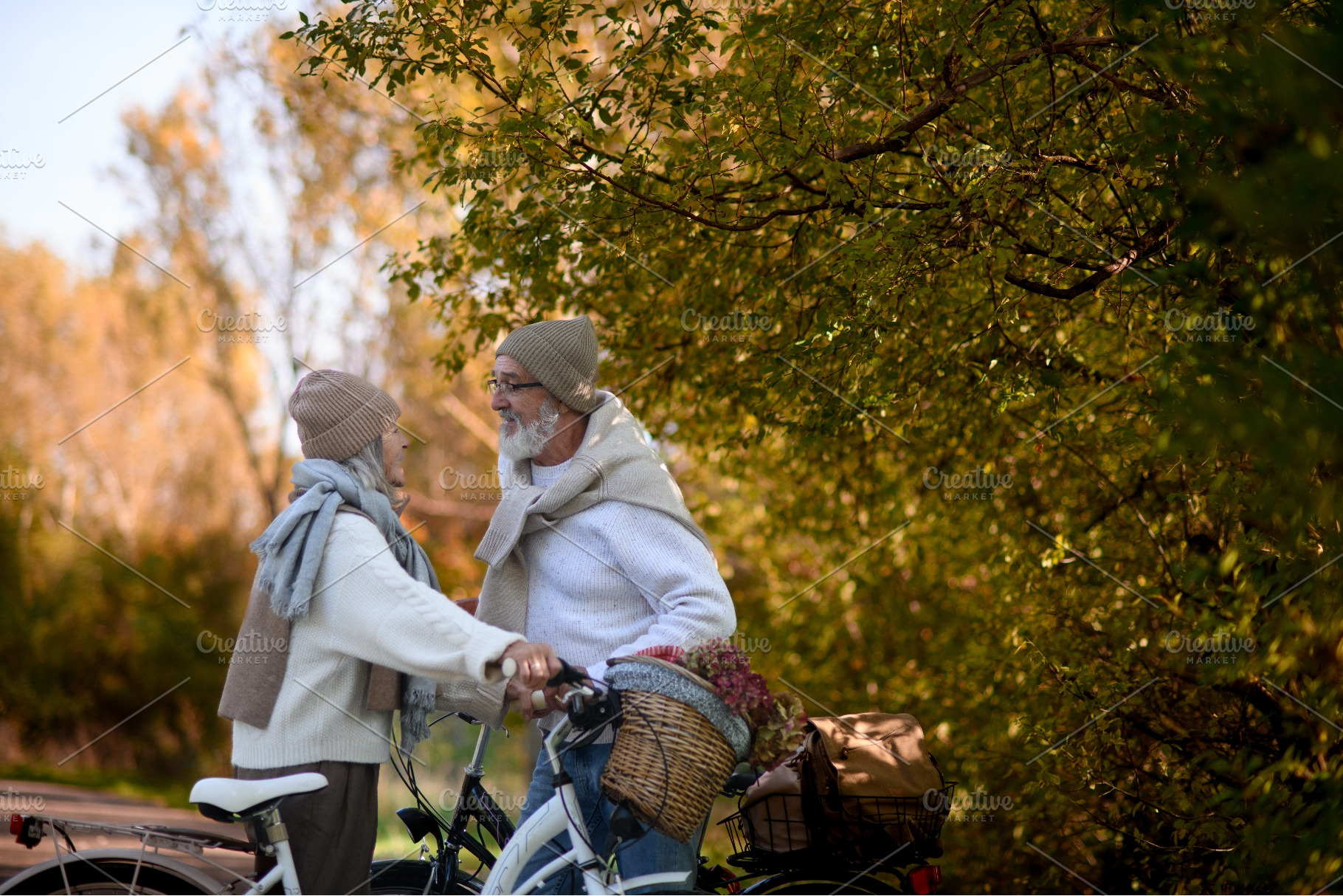 Senior couple standing with bicycles, a Sports & Recreation Photo by HalfPoint