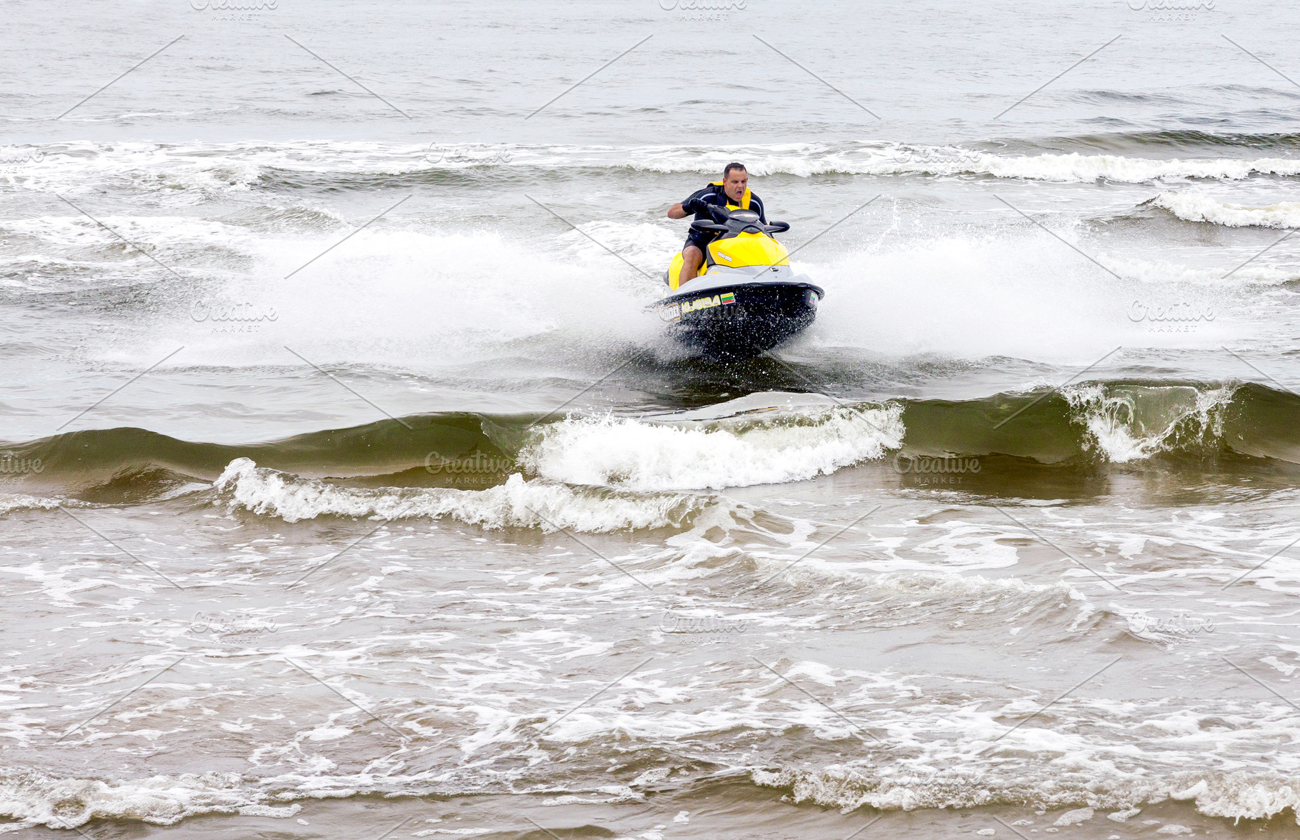Man performing tricks on jet ski, a Sports & Recreation Photo by BOOCYS