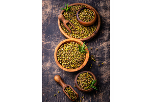 Raw uncooked mung beans on black, a Food & Drink Photo by Yulia Furman