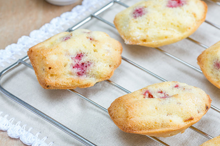 Madeleines cookie with raspberry on cooling rack, a Food & Drink Photo by iuliia_n