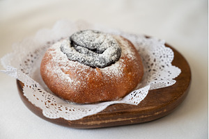 Poppy seed bun with powdered sugar, a Food & Drink Photo by Jan Jack Russo Media