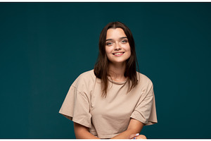 Young woman confidently smiling, a Person Photo by volodymyrshtun13795