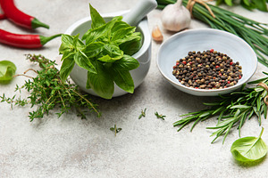 Fresh herbs and spices creating culinary masterpiece on table, a Food & Drink Photo by Olena Rudo