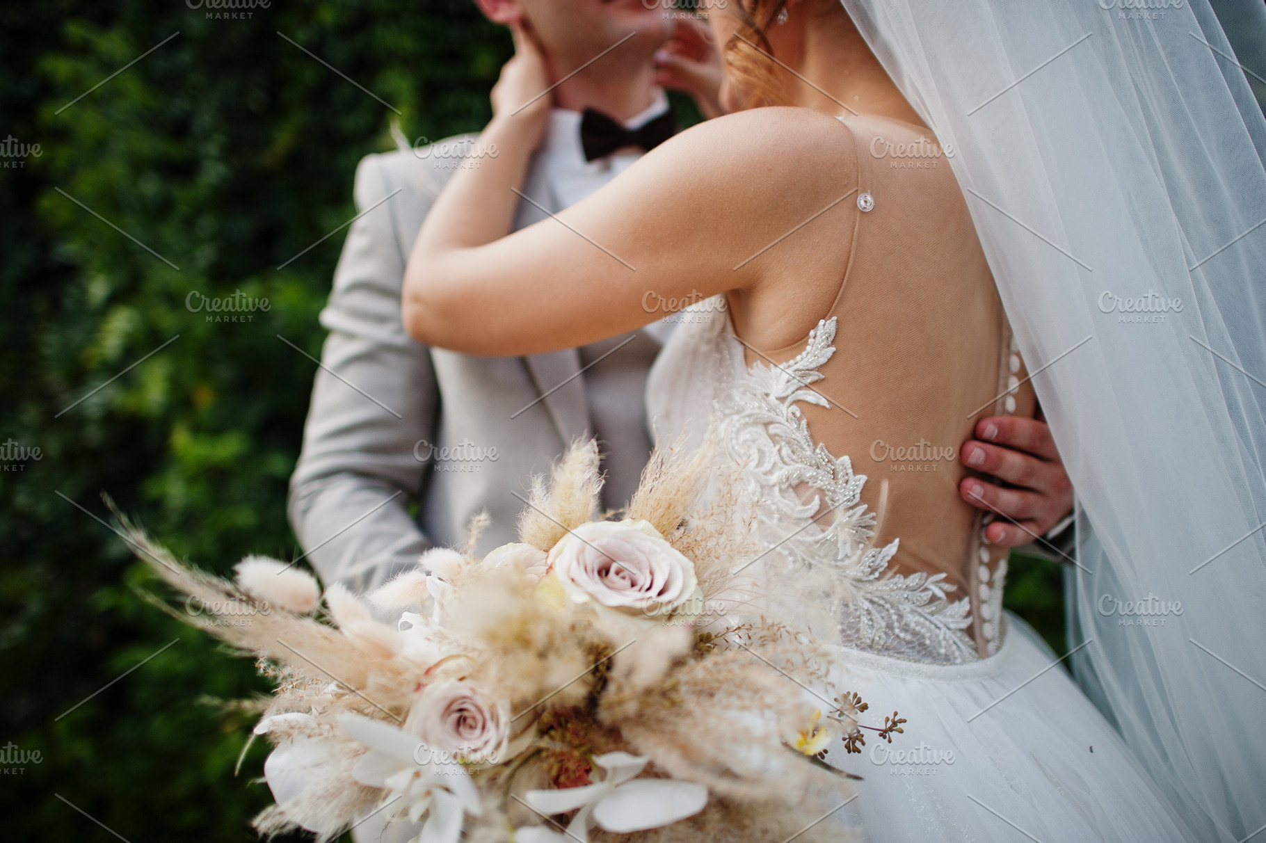 Bride and groom holding beautiful tender wedding bouquet., a Photo by AS photostudio