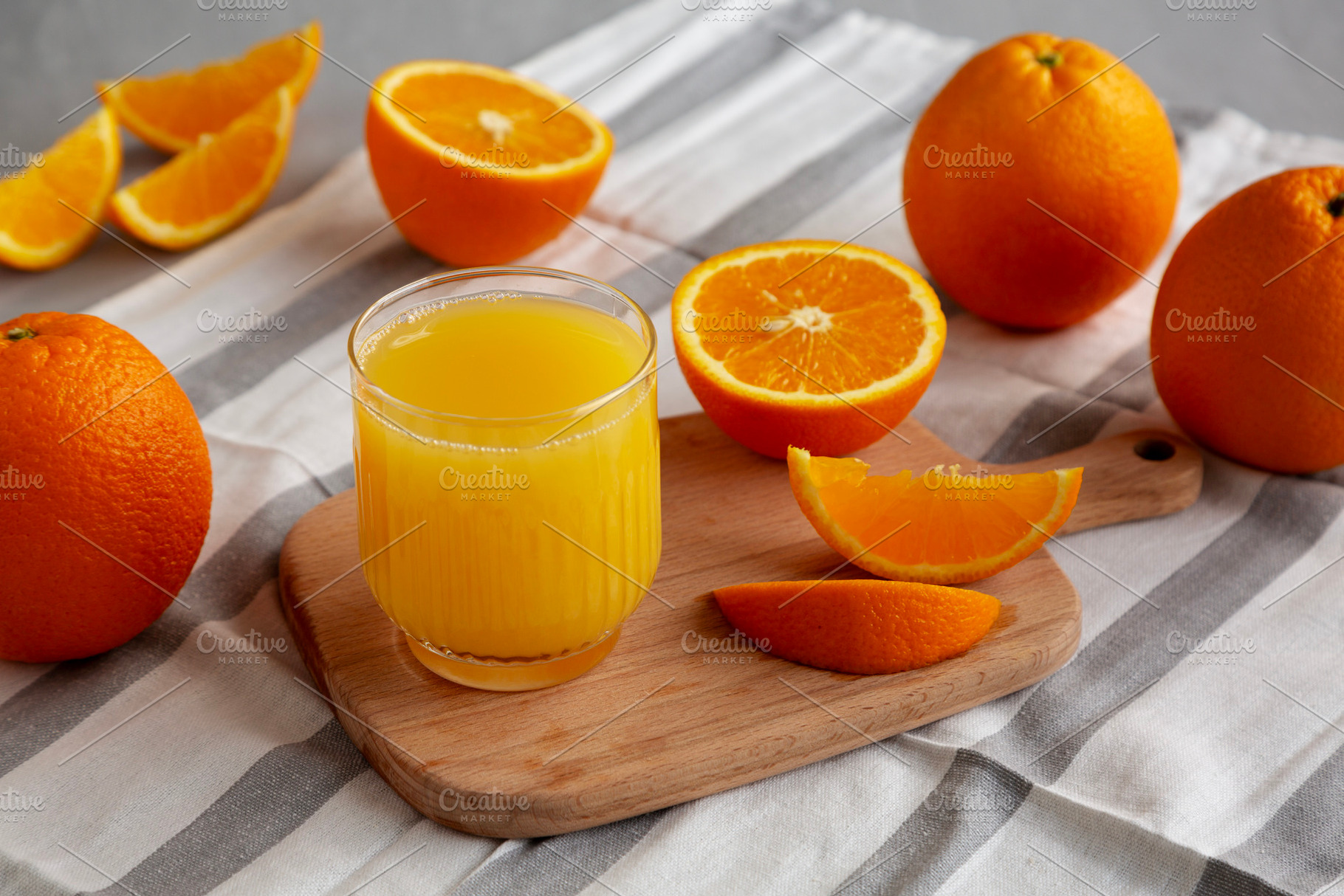Organic Orange Juice in a Glass, side view., a Food & Drink Photo by LiudmylaChuhunova