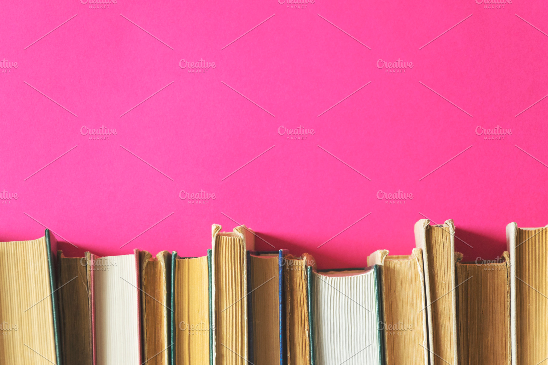 Old books on a pink background, a School & Education Photo by Ti-Di