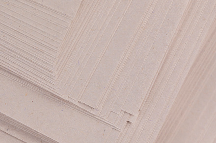 grey low-quality thin paper from recycled waste, a Photo by MyPhotos