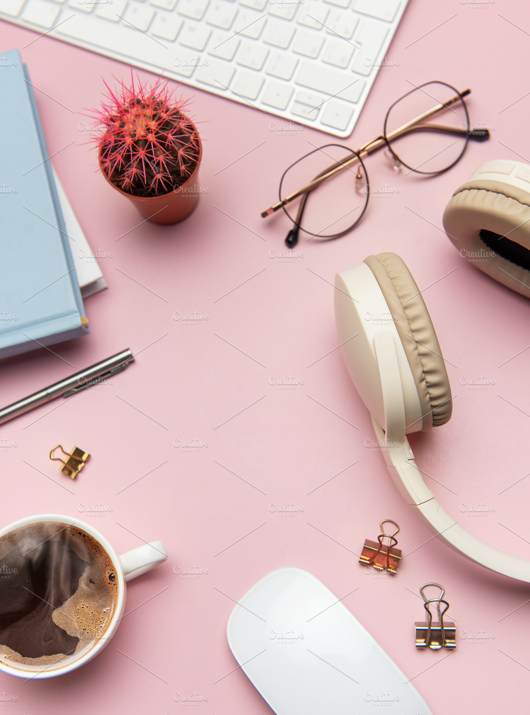 Pink workspace with keyboard, headphones, glasses, coffee, mouse, a Business Photo by Olena Rudo