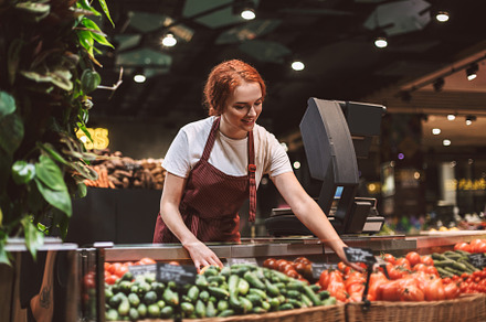 Young smiling seller in apron behind featuring enjoy, communicable, and