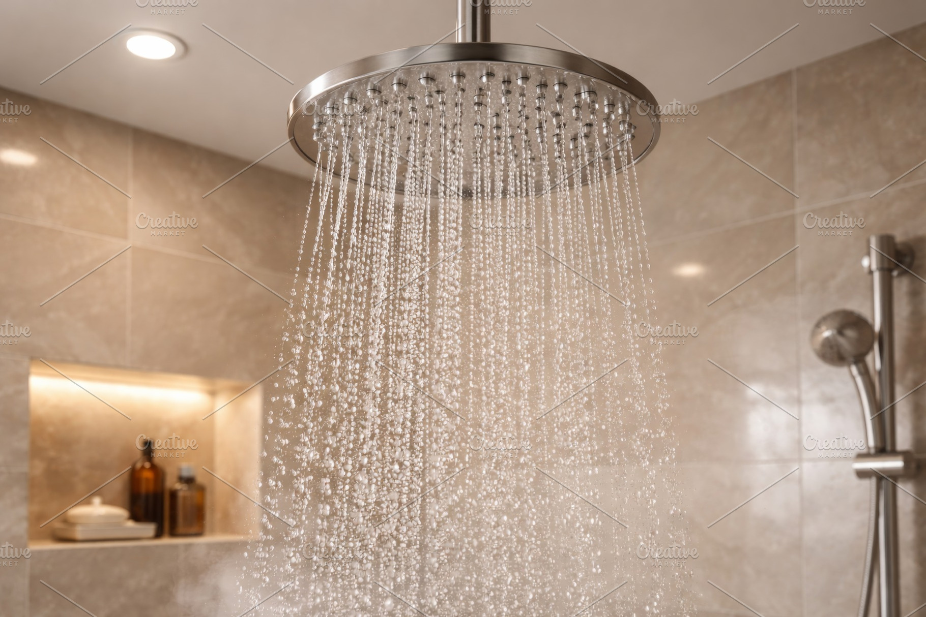Showerhead releasing water in bathro, a Photo by Dvoevnore photos