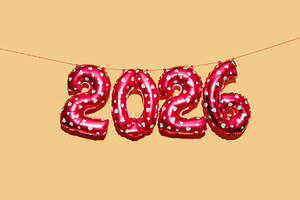 balloons display number 2026 as the new year, a Photo by Nito