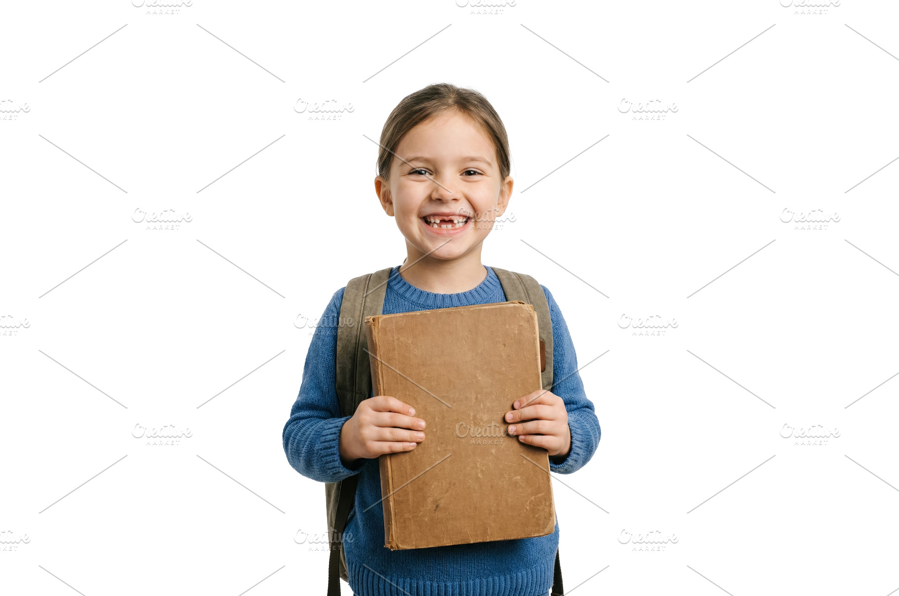 Smiling Girl With Book, a School & Education Photo by CREATIVEDEF
