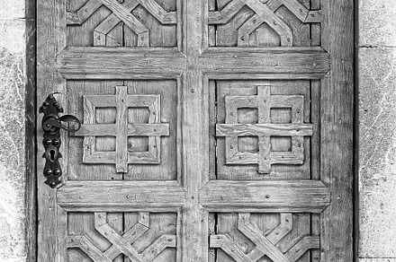 Old antique wooden door in a wall built of stone., an Abstract Photo by Eugene_Photo