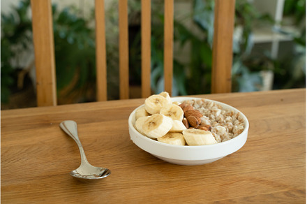 Oatmeal with banana, honey and, a Food & Drink Photo by oksix