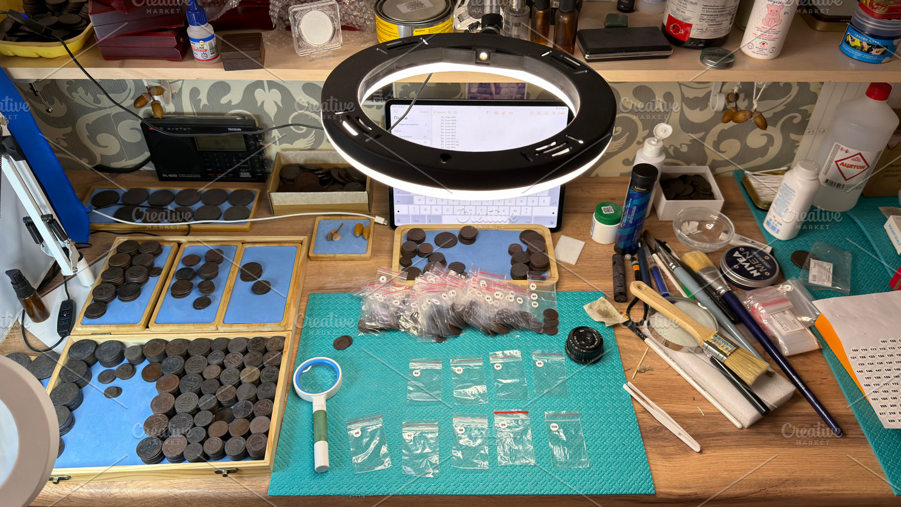 A workspace with coin collecting tools, coins, and accessories., an Industrial Photo by Textures & Backgrounds