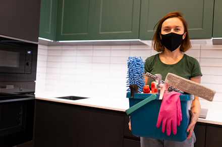 Portrait of female worker cleaning, a Photo by borodai94