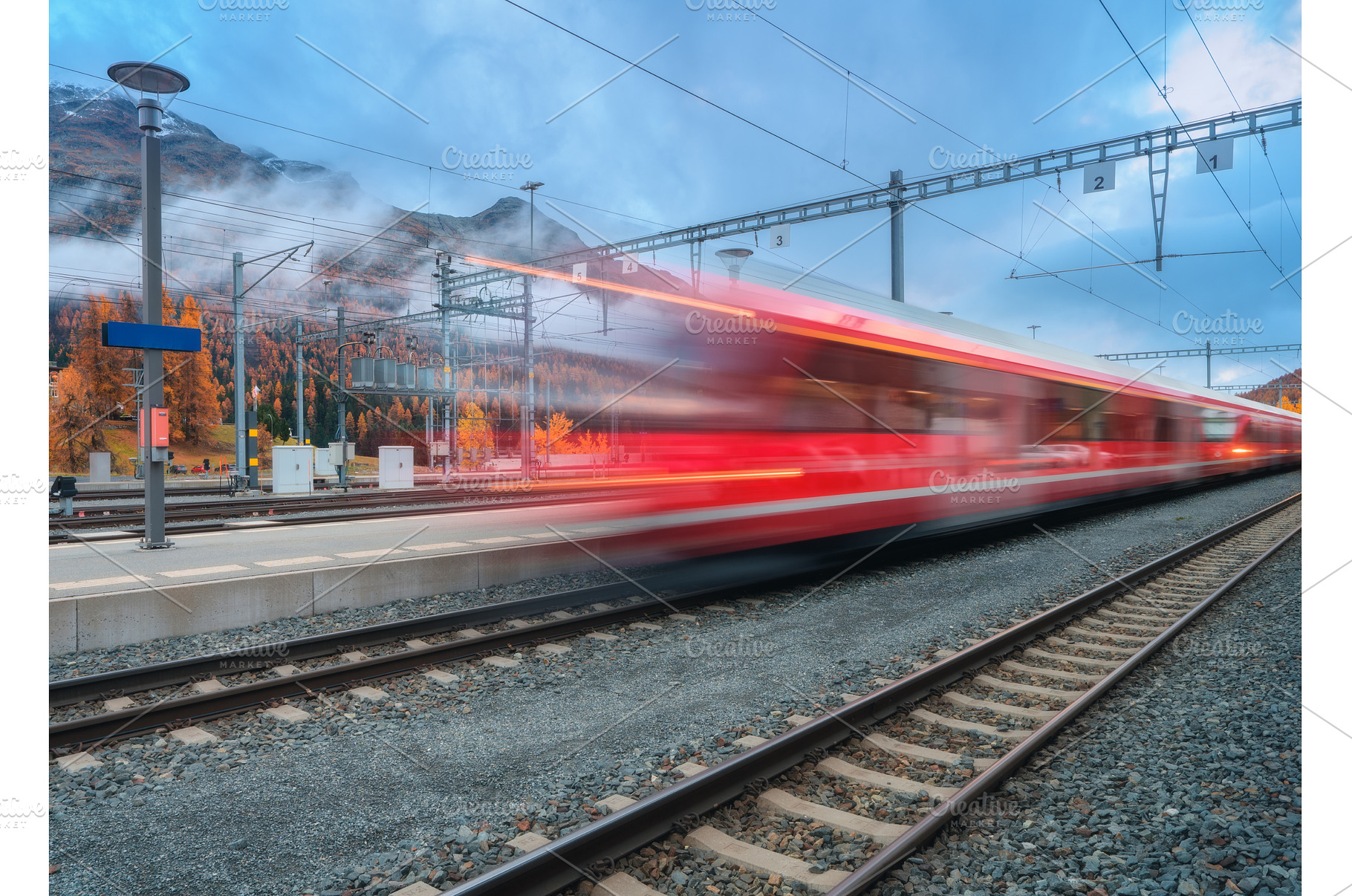 Blurred red passenger train passing, a Transportation Photo by den-belitsky