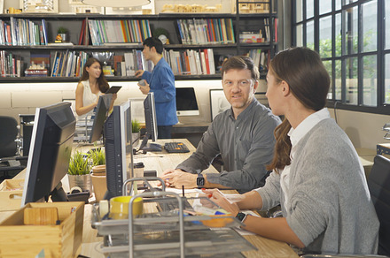 A group of multi ethnic business team talk, communicate, discuss, a Photo by Tampatra