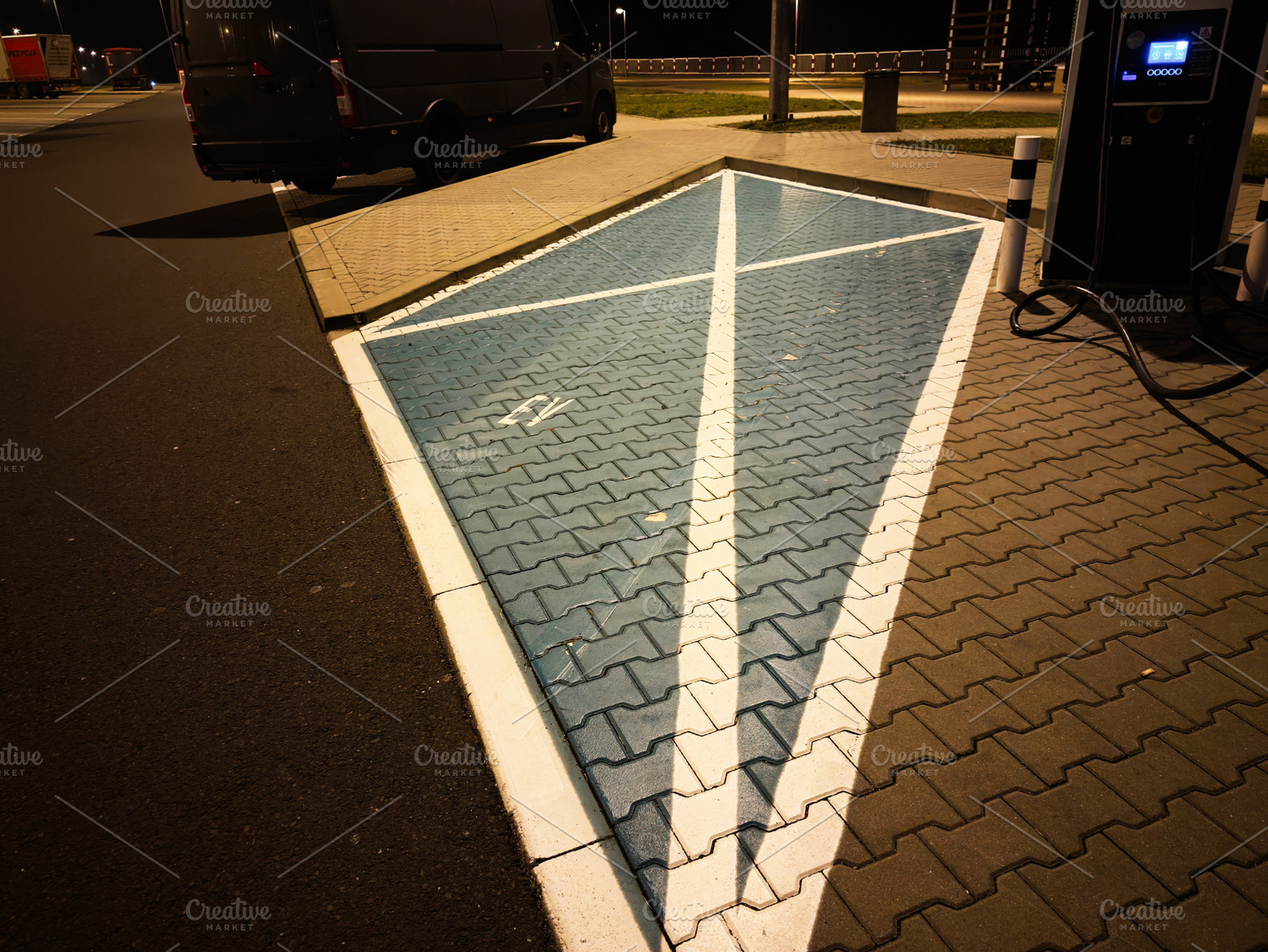 Night scene of electric vehicle charging station in Poland with blue paving and, a Photo by AS photostudio