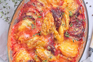 Gratin with sweet potato, parsnips, beet root and melted cheese, in glass dish,, a Food & Drink Photo by iuliia_n