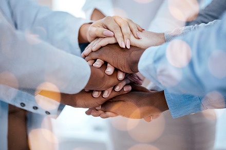 Business people, hands stack and solidarity for teamwork, team building or trust. Collaboration, huddle and group or staff of men and women with hand together for motivation, unity and support bokeh., a Photo by Peopleimages.com