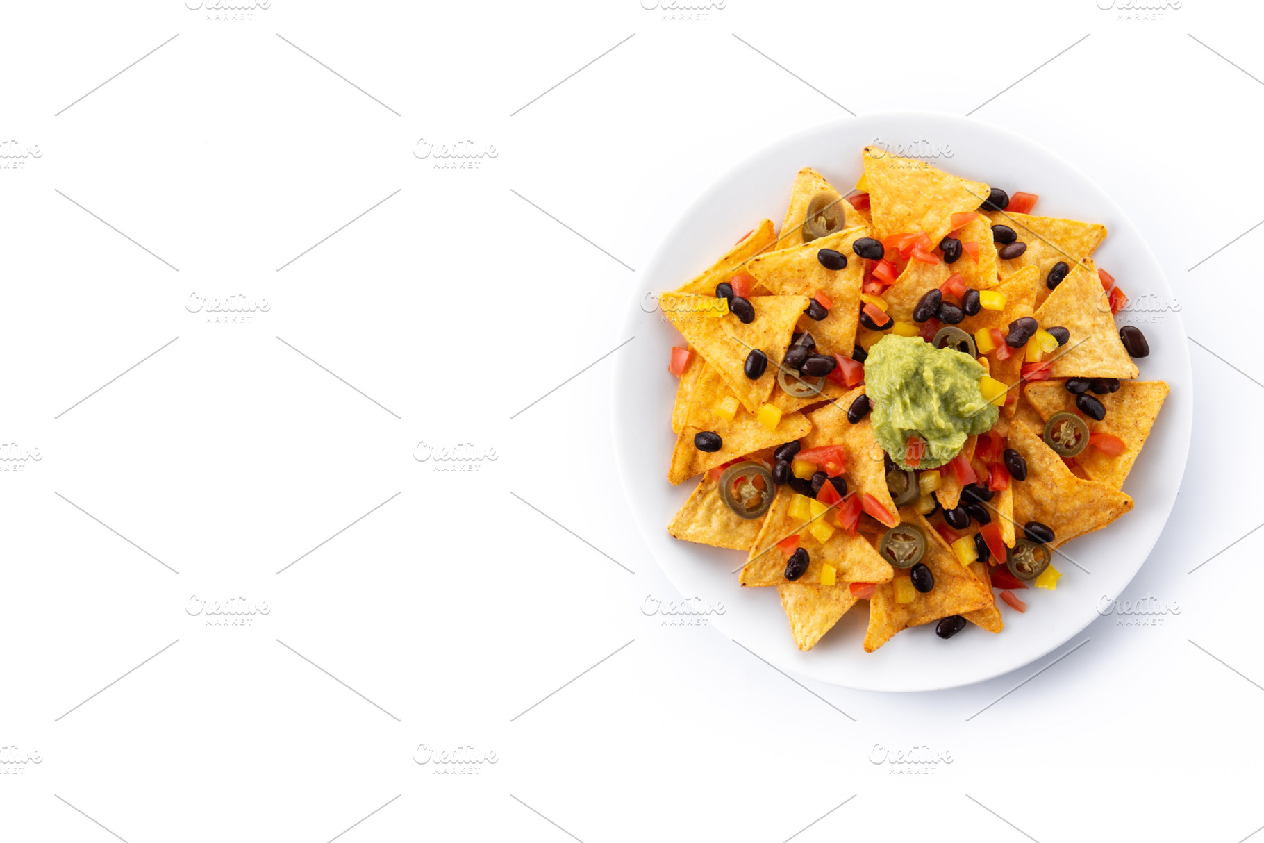 Mexican nachos tortilla chips with black beans, guacamole, tomato and jalapeno, a Background Photo by etorres69